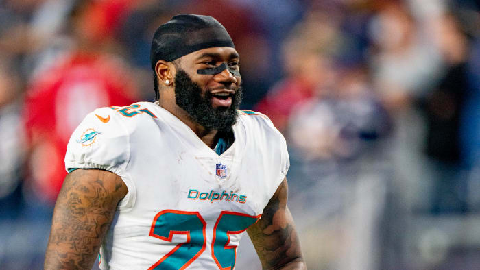 Xavien Howard smiles on the field during warmups before a Dolphins-Patriots season-opening game in 2021